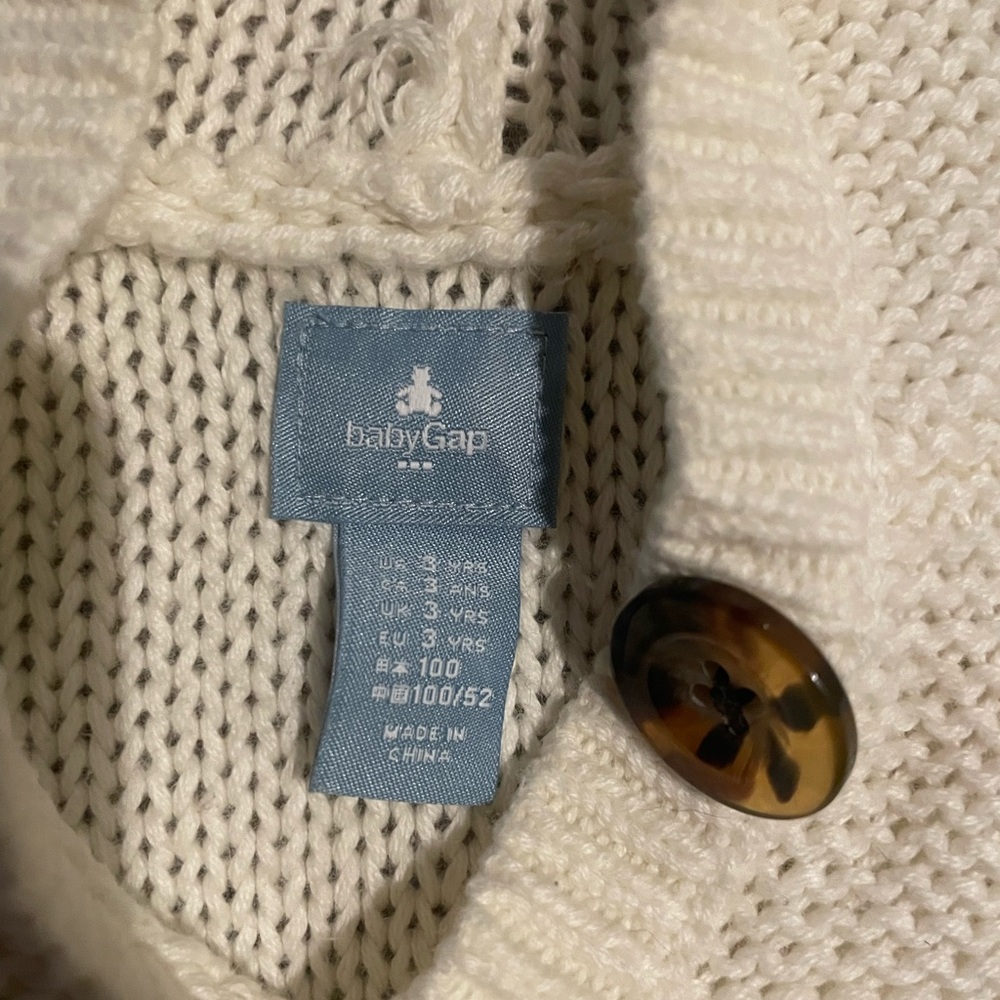 White and red knitted poncho from Gap